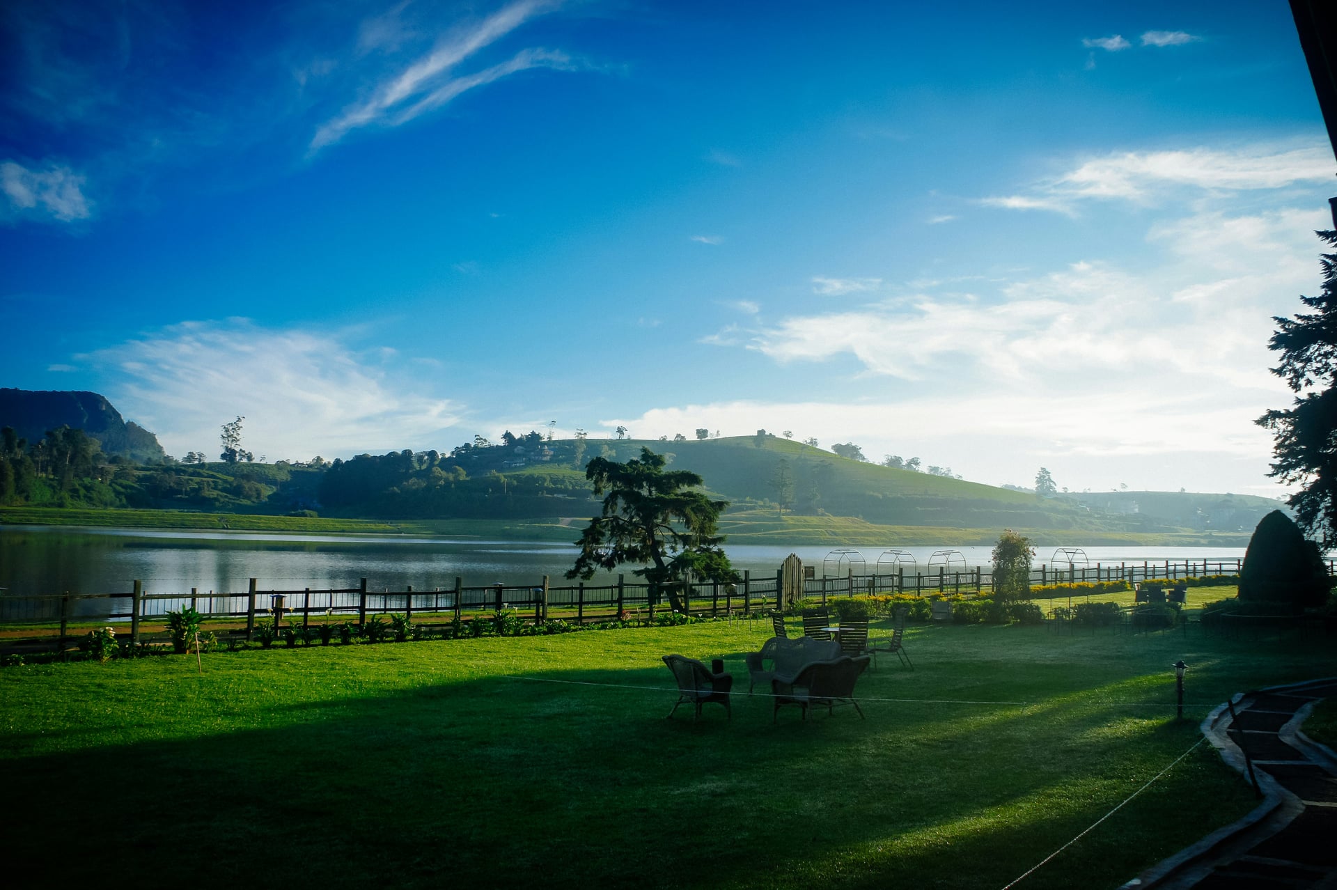 Gregory Lake Nuwara Eliya at dawn with morning mist and manicured garden