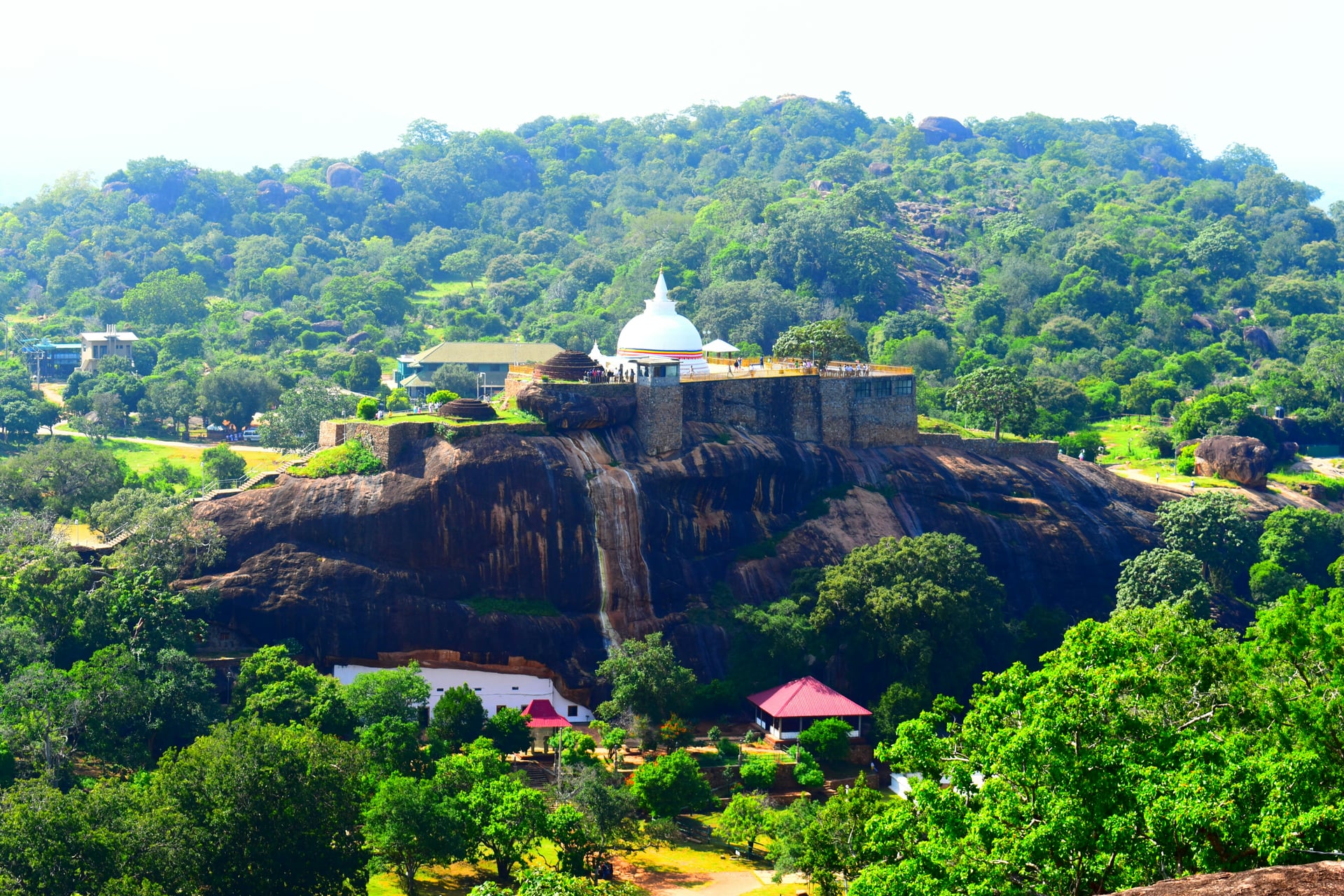 Ancient Sri Lanka rock fortress with white stupa overlooking the surrounding plains