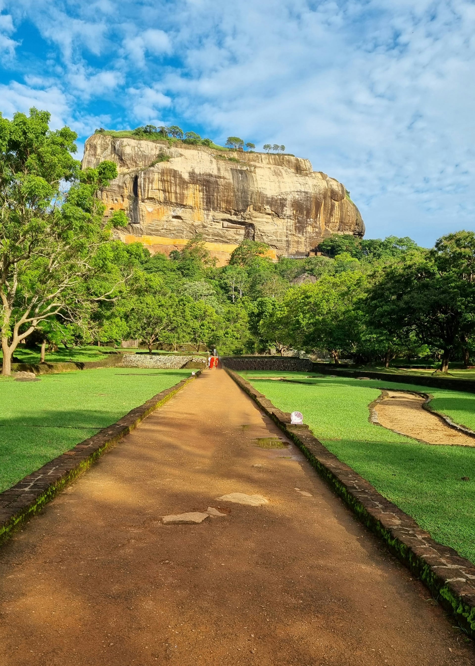 Sigiriya Rock Fortress viewed from the ancient water garden causeway pathway