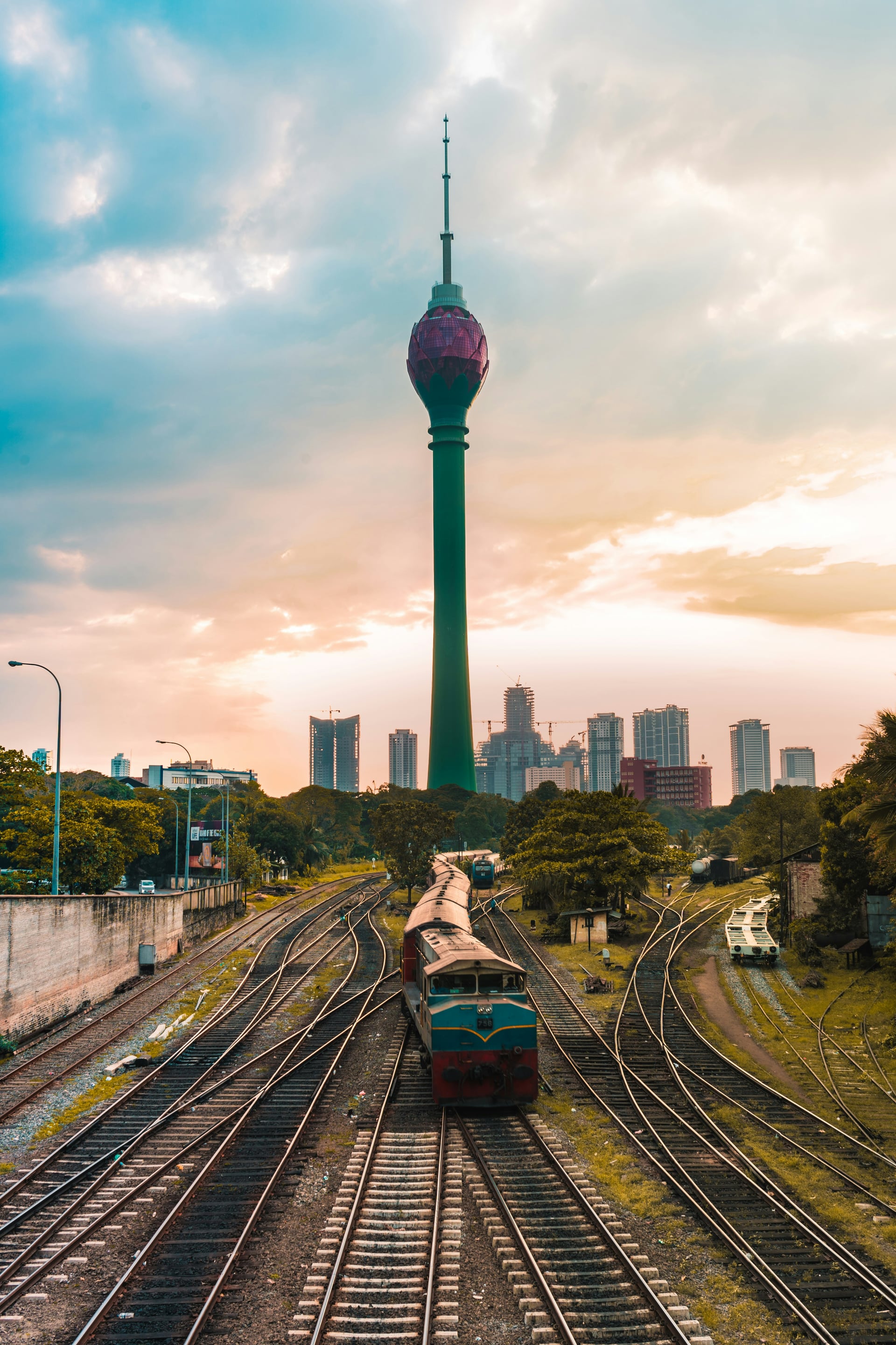 Colombo Lotus Tower with railway tracks winding through the city at sunset