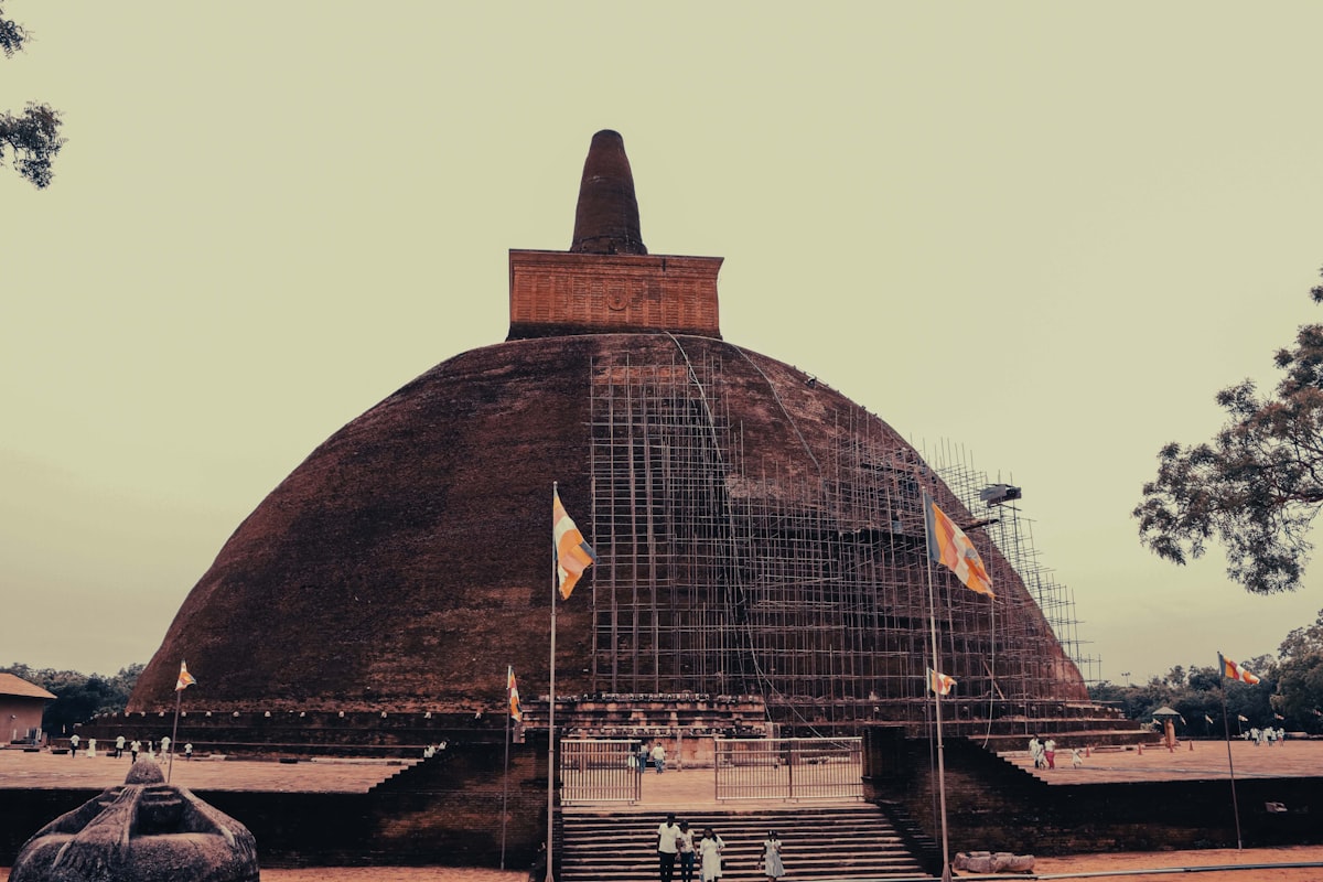 The white dome of Ruwanwelisaya Dagoba gleaming under a clear blue sky in Anuradhapura